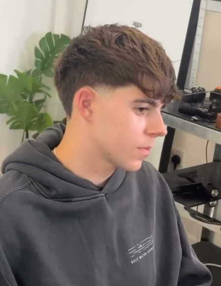 Messy textured fringe with low taper fade